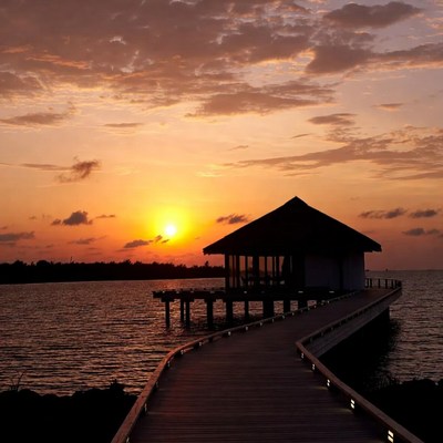 Sunset Overwater Bungalow with Wooden Pier
