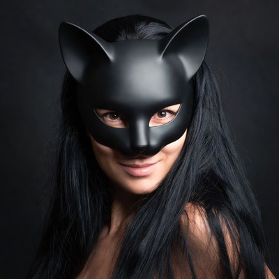 Woman wearing black cat mask