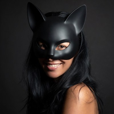 Asian woman in black cat mask
