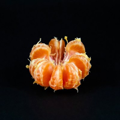Peeled Mandarin Orange on Black
