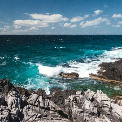 Turquoise Ocean Waves Crashing on Rocks