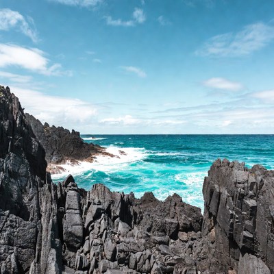 Ocean Waves Crashing on Black Volcanic Rocks