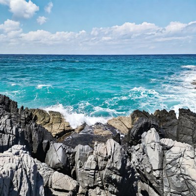 Turquoise Ocean Waves Crashing on Rocks