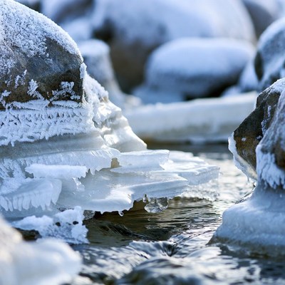 Snow-Covered Rocks and Ice in Stream
