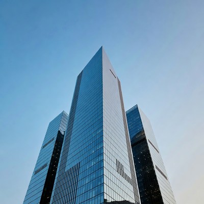 Modern Glass Skyscrapers Against Blue Sky