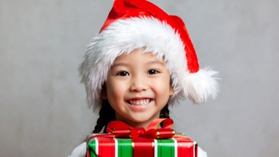 Asian girl holding Christmas gift