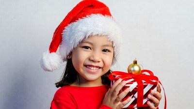 Asian girl holding Christmas gift