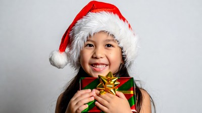 Asian girl holding Christmas gift