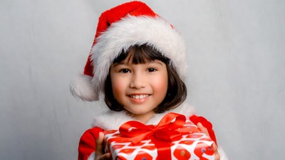 Asian girl holding Christmas gift