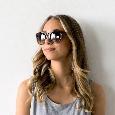 Woman wearing tortoiseshell sunglasses