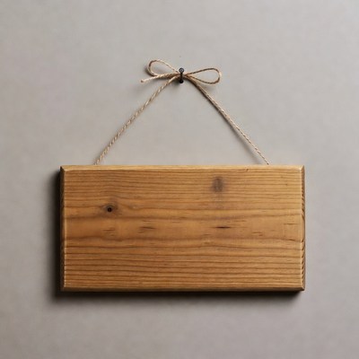 Blank wooden sign hanging by rope