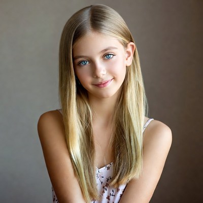 Blonde girl smiling in floral top