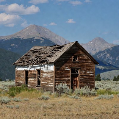 Abandoned Cabin in Mountain Landscape