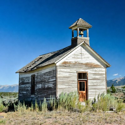 Abandoned White Church with Bell Tower