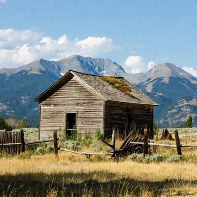 Abandoned Cabin in Mountain Landscape