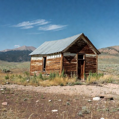 Abandoned Wooden Cabin in Desert Mountains
