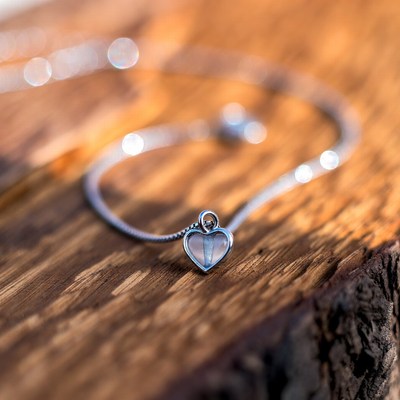 Silver Heart Pendant Necklace on Wood