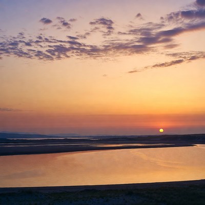 Sunset over river and beach