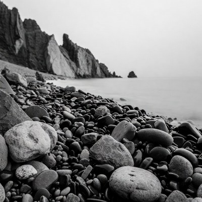 Black and White Pebble Beach Cliffs