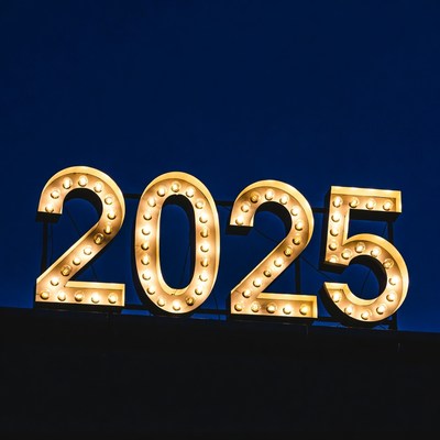 Glowing 2025 Sign on Blue Background