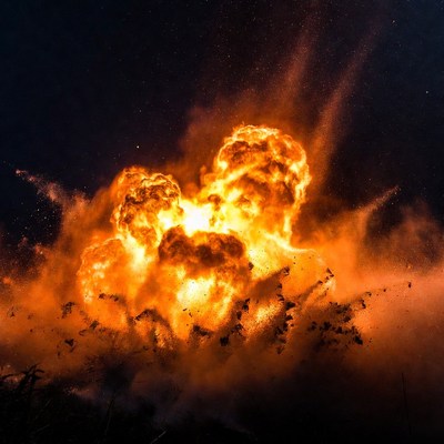 Massive fiery explosion in dark sky