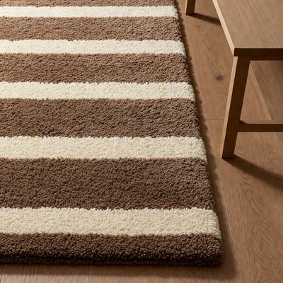 Striped Brown White Rug on Wood Floor