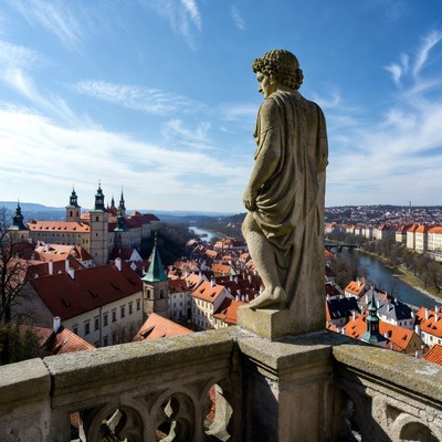 Statue overlooking Prague rooftops