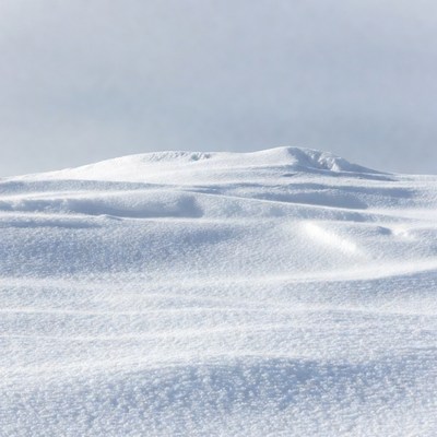 Snowy Hill in Vast Landscape