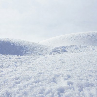 Snowy Hills Under Cloudy Sky