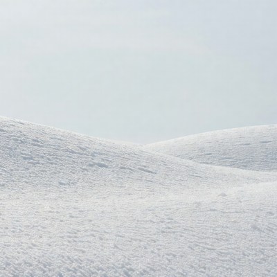 Snowy Hills Under Gray Sky