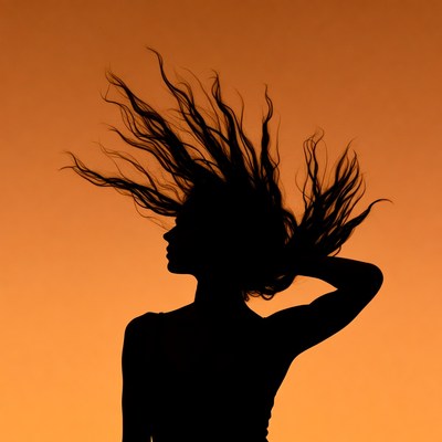 Woman silhouette with flowing hair