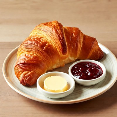 Croissant with butter and jam