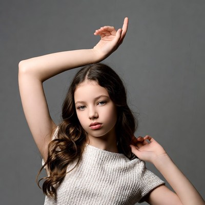 Girl posing with arms raised