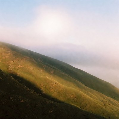 Green Hills in Misty Clouds