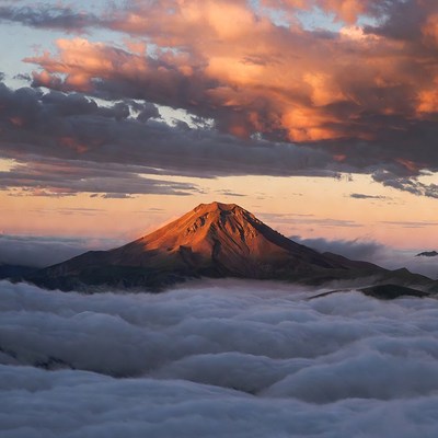 Volcano Peak Above Clouds at Sunset
