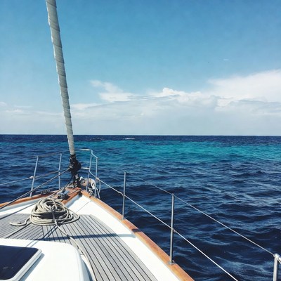 Sailboat on turquoise ocean