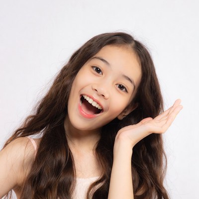 Asian girl smiling with hand gesture