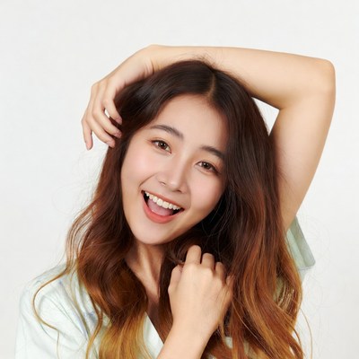 Asian woman smiling with hand on head
