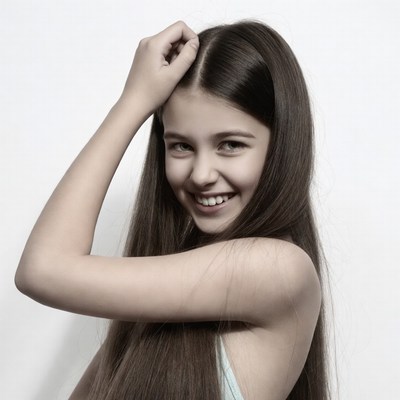 Smiling girl touching hair
