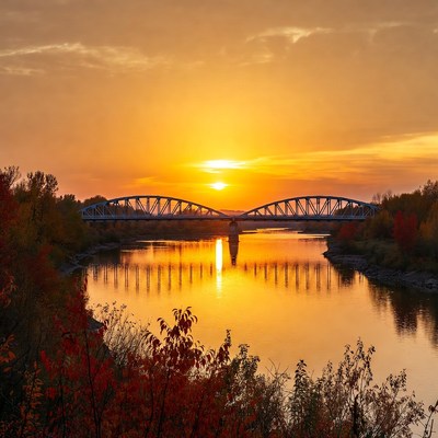 Blue Bridge Over River at Sunset