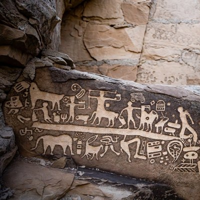 Ancient Rock Petroglyphs with Animals and Figures