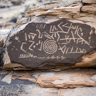 Ancient Petroglyphs on Desert Rock