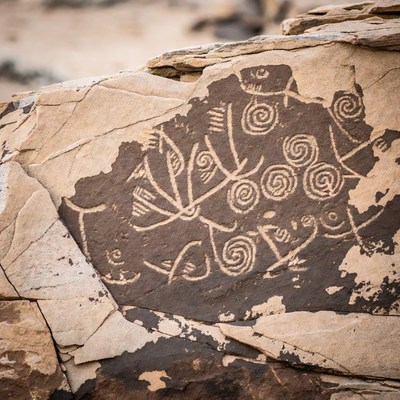 Ancient petroglyphs on desert rock