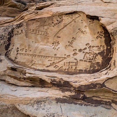 Ancient Petroglyphs on Sandstone Cliff