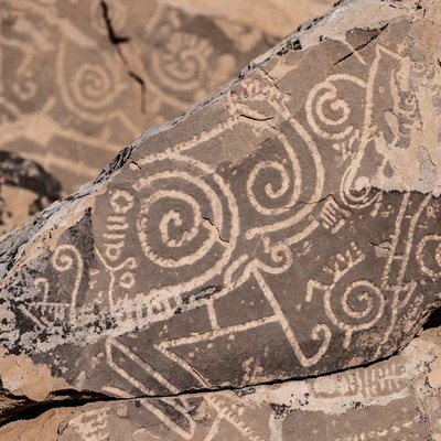 Ancient Petroglyphs on Desert Rock