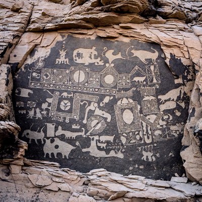 Ancient rock art petroglyphs with animals