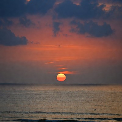 Sunset over ocean horizon