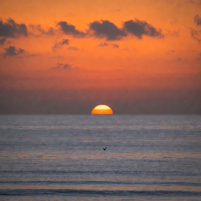 Sunset over calm ocean