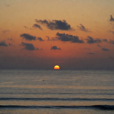 Sunset over ocean waves