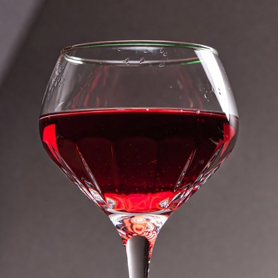 Red Wine Glass on Gray Background